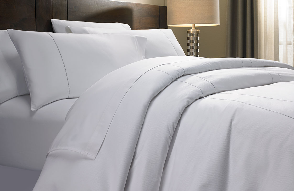 Cover image for article: White Bed Sheets: 7 Brilliant Reasons Hotels Love Them